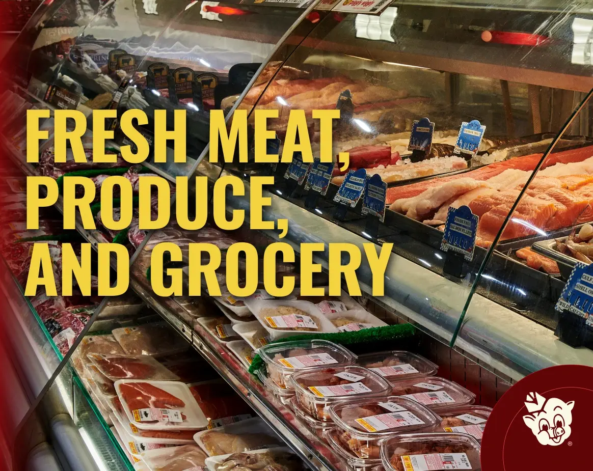 Fresh meat and seafood displayed in grocery store deli case with fresh meat produce and grocery text overlay